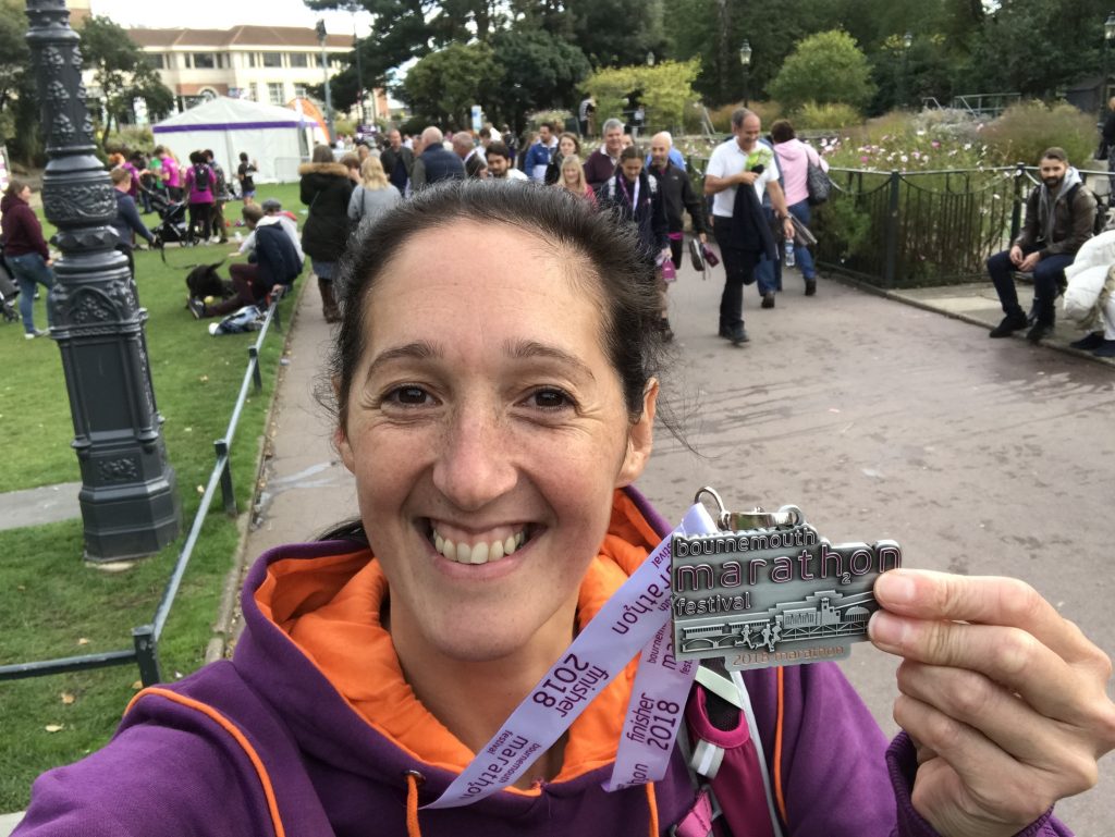 Me and my Bournemouth marathon medal in Bournemouth Gardens