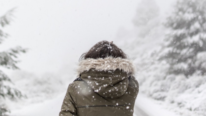 How To Stay Healthy This Winter - Girl walking in the snow