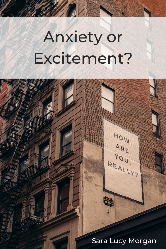 Anxiety or excitement - building with a billboard poster asking "How are you really?"