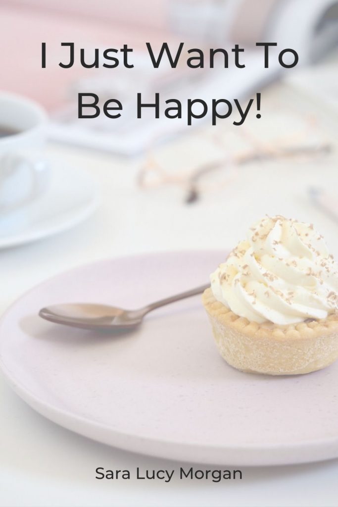 I just want to be happy - picture of cream tart on a pink plate with a small spoon