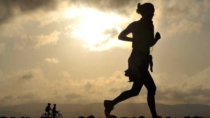 Running is hard - silhouette of a woman running.